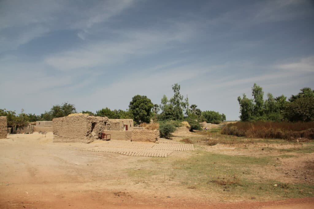 A hut of bricks and in the background trees. A hut of bricks and in the background trees.