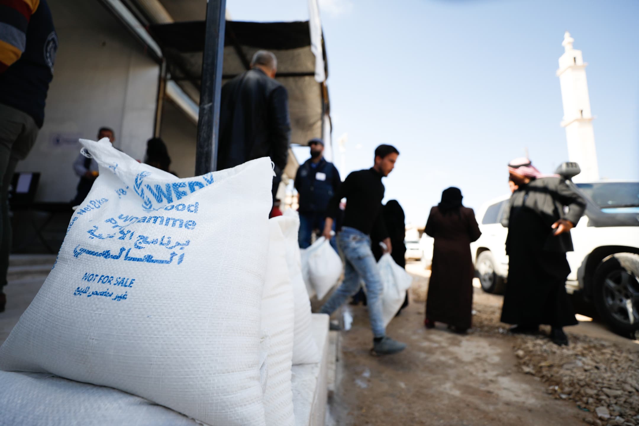 Bags with food and in the background people carrying bags. Bags with food and in the background people carrying bags.