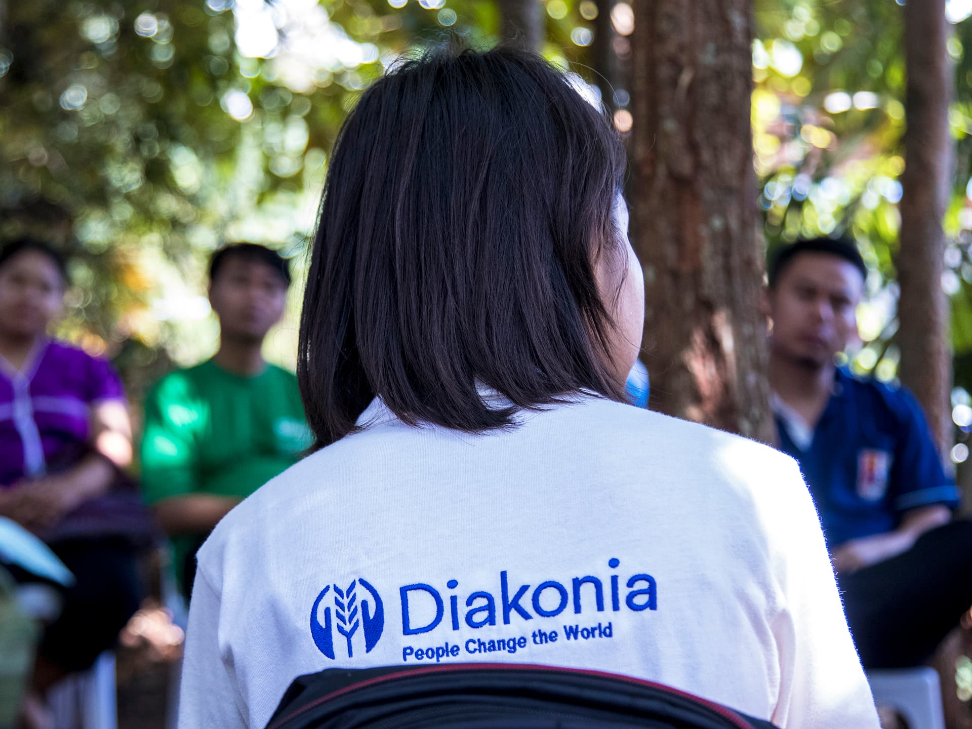 Photo: Diakonia A girl's back with Diakonia t-shirt on