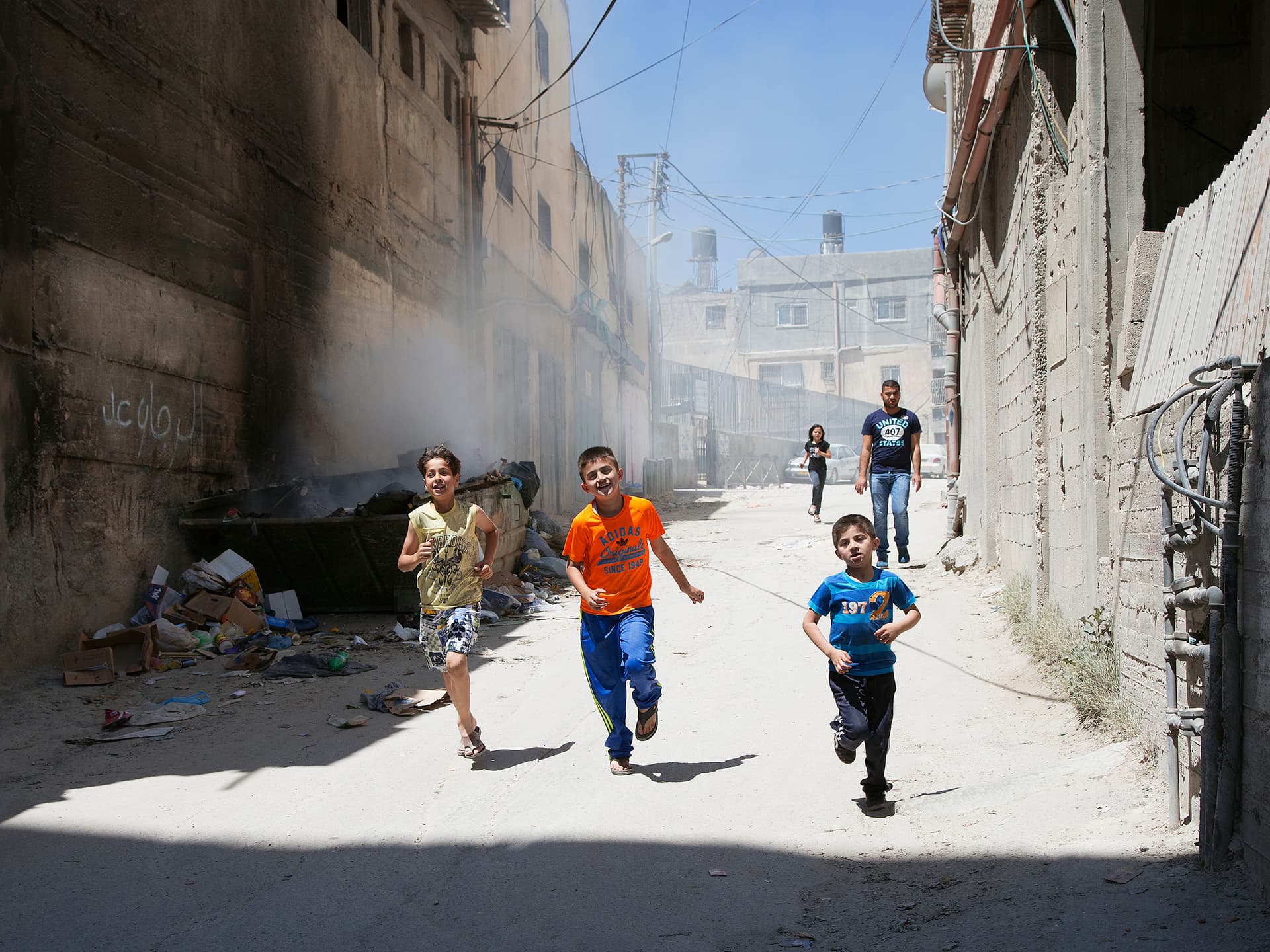 Photo: Diakonia Children running in the streets of a refugee camp