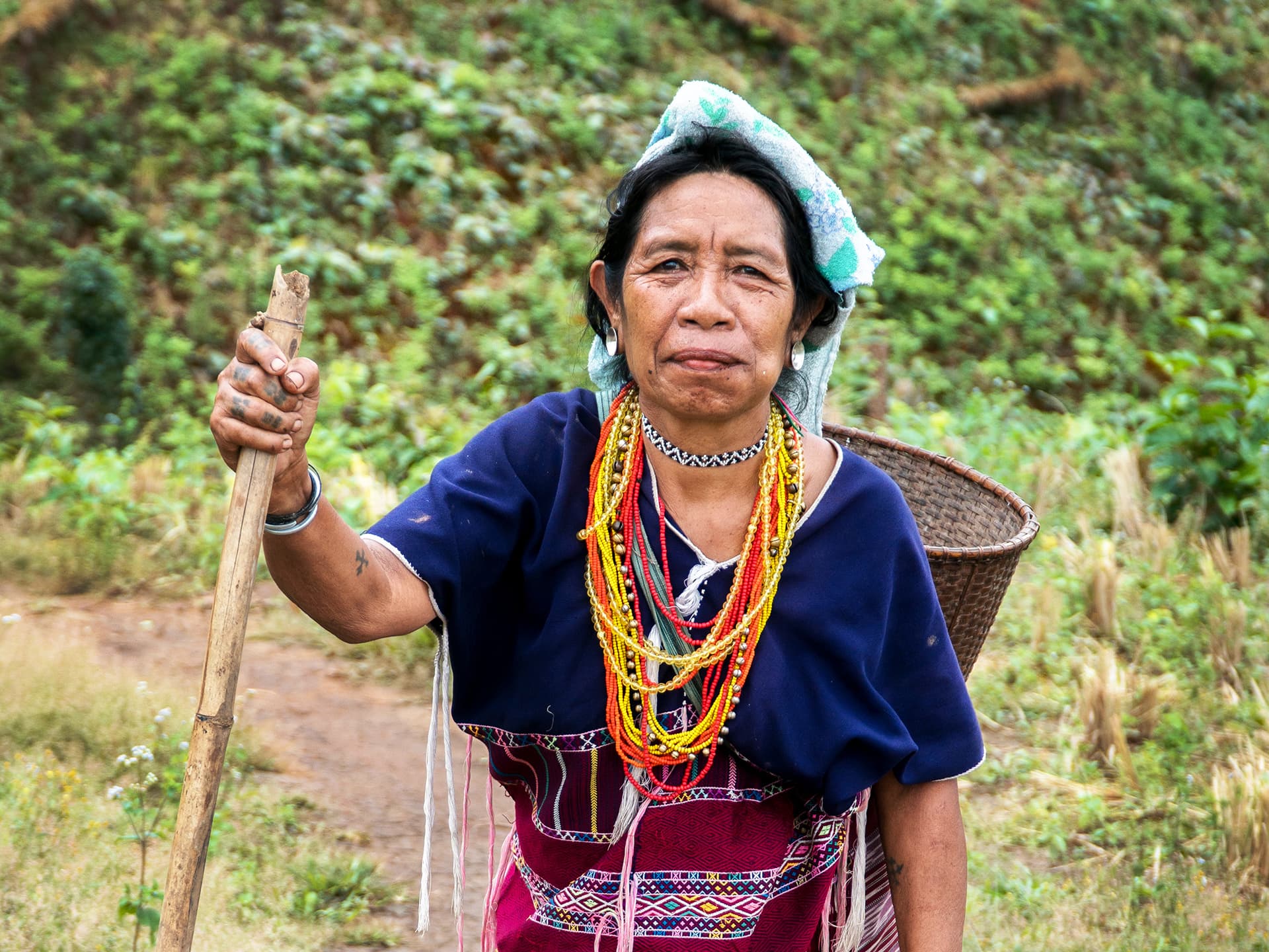 Photo: Sean Dalton A Thai woman standing in a field.